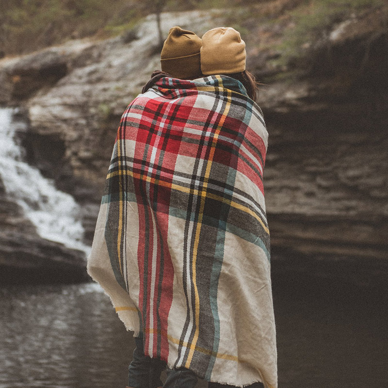 Couple standing together outdoors